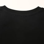 PRADA T-shirt with small figure graphic at the neckline